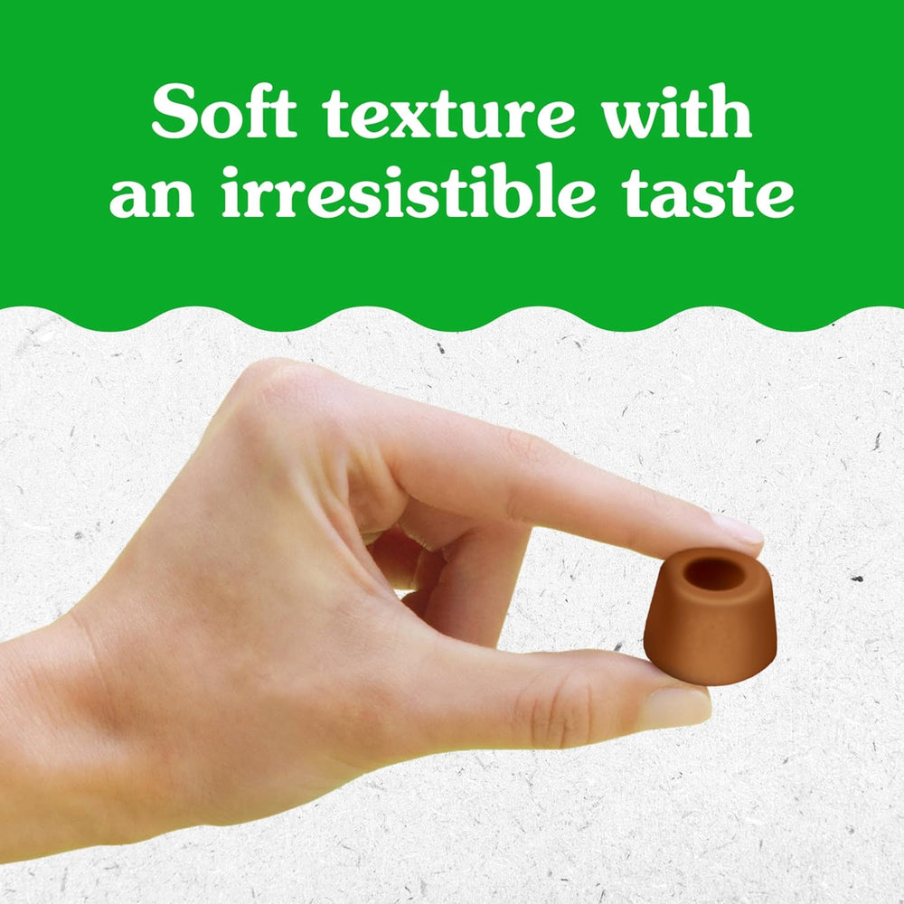 Hand holding a small brown object against a green and white background with text about texture and taste.
