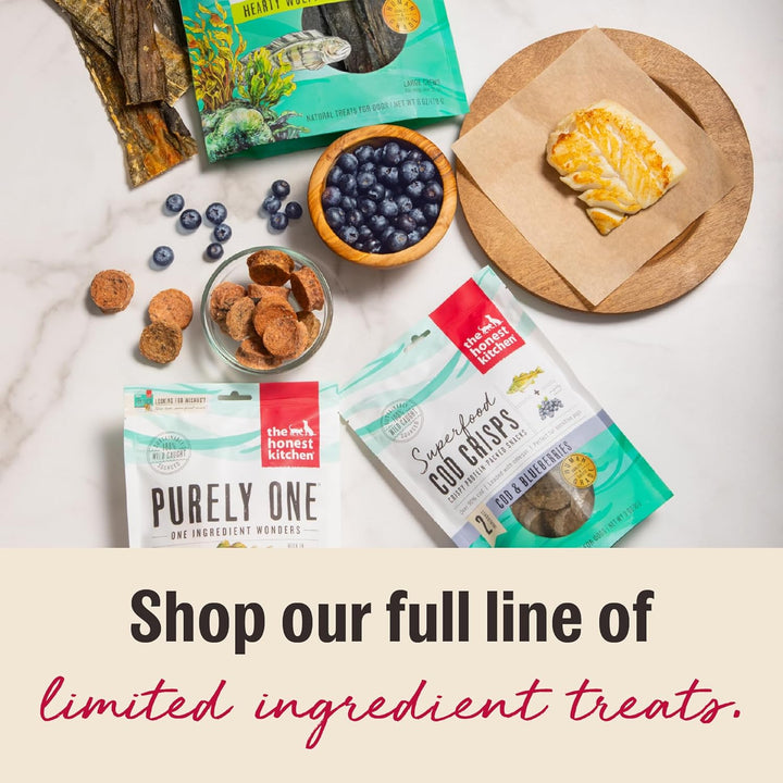 Assorted pet treats and products on a marble surface with 'The Honest Kitchen' branding. The Honest Kitchen Human Grade Ocean Chews Crispy Cod Fish Skins, 5.5 Ounces- 3 PACK