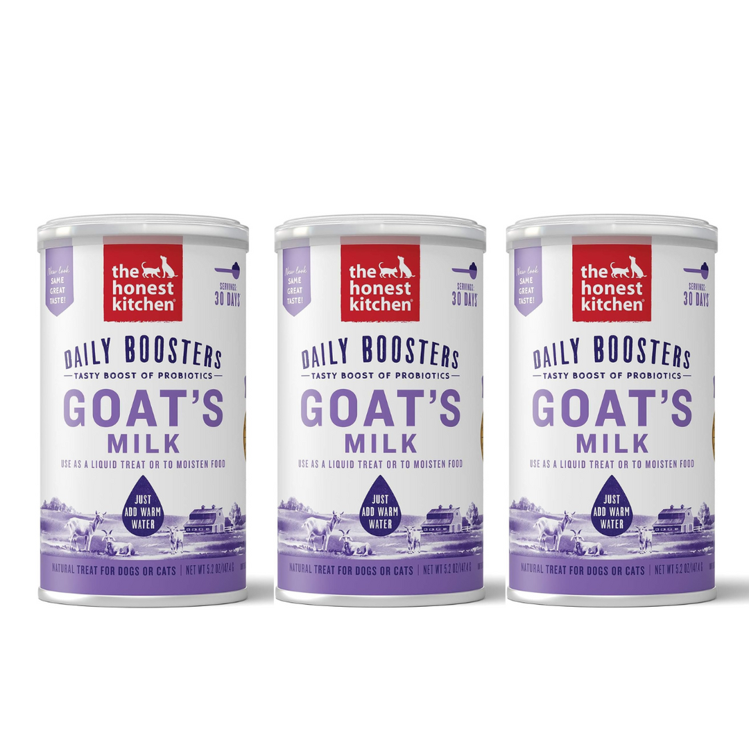 Three cans of 'The Honest Kitchen' Daily Boosters Goat's Milk on a white background