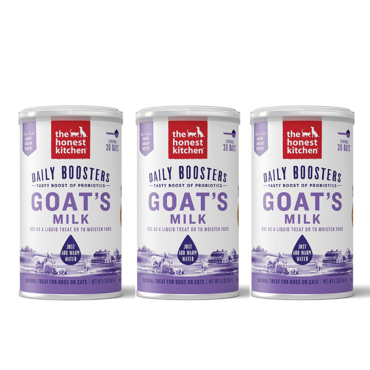 Three cans of 'The Honest Kitchen' Daily Boosters Goat's Milk on a white background