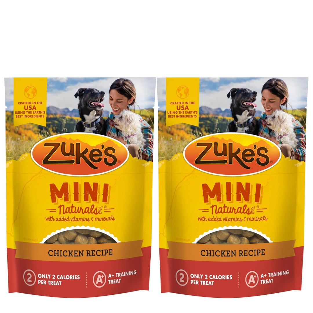 Two packages of Zuke's Mini Naturals dog treats with a woman and dog on the label. Zuke's Mini Naturals Dog Treats Chicken Flavor 16 oz
